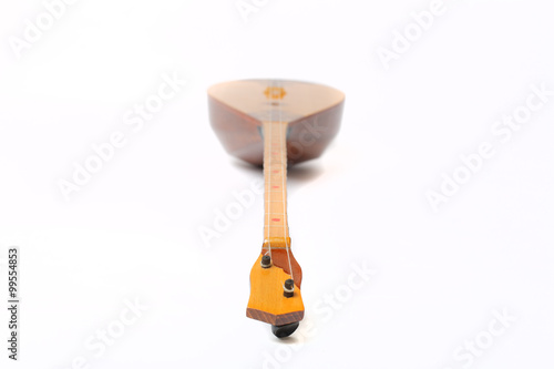 Kazakh national instrument dombra and taikazan on white background photo