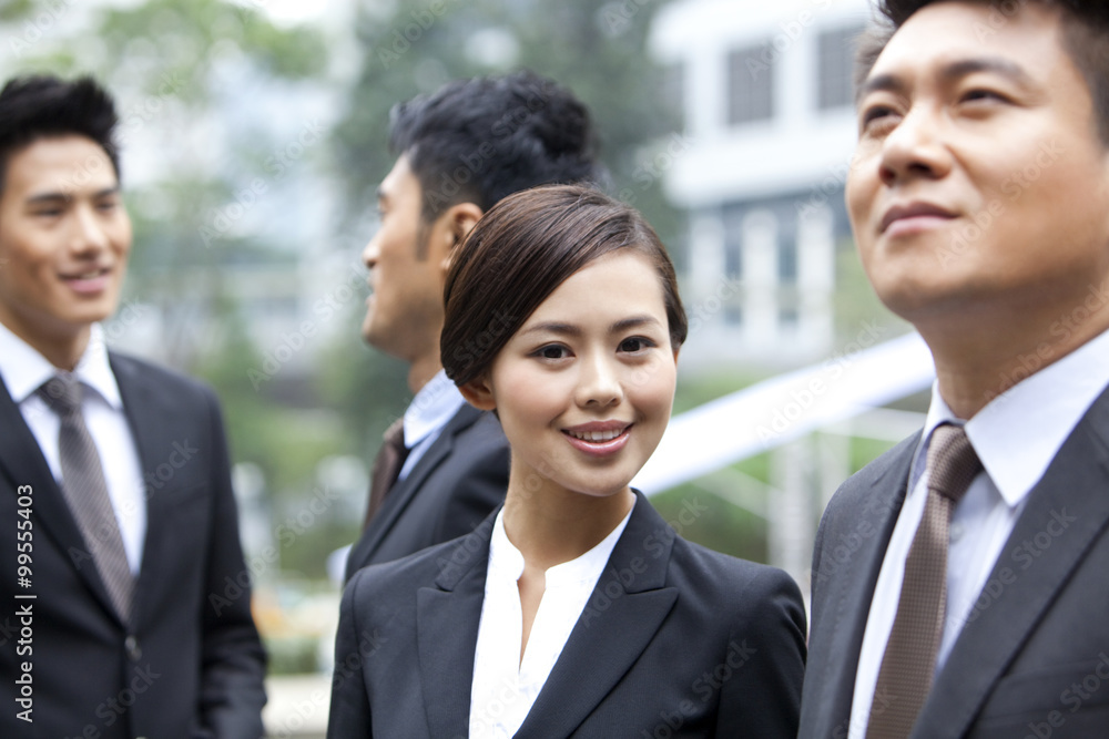 Cheerful businesswoman with her team in Hong Kong Cheerful businesswoman with her team in Hong Kong