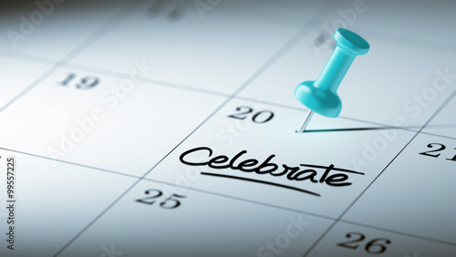 Concept image of a Calendar with a blue push pin. Closeup shot o photo