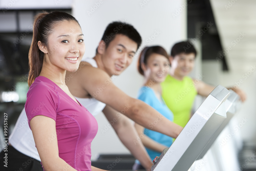 Four People on Treadmills