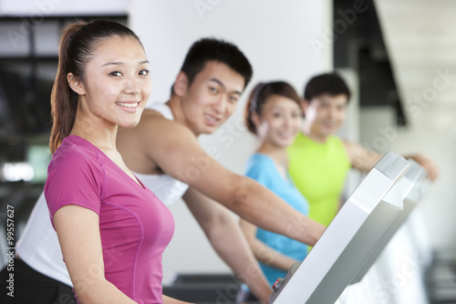 Four People on Treadmills