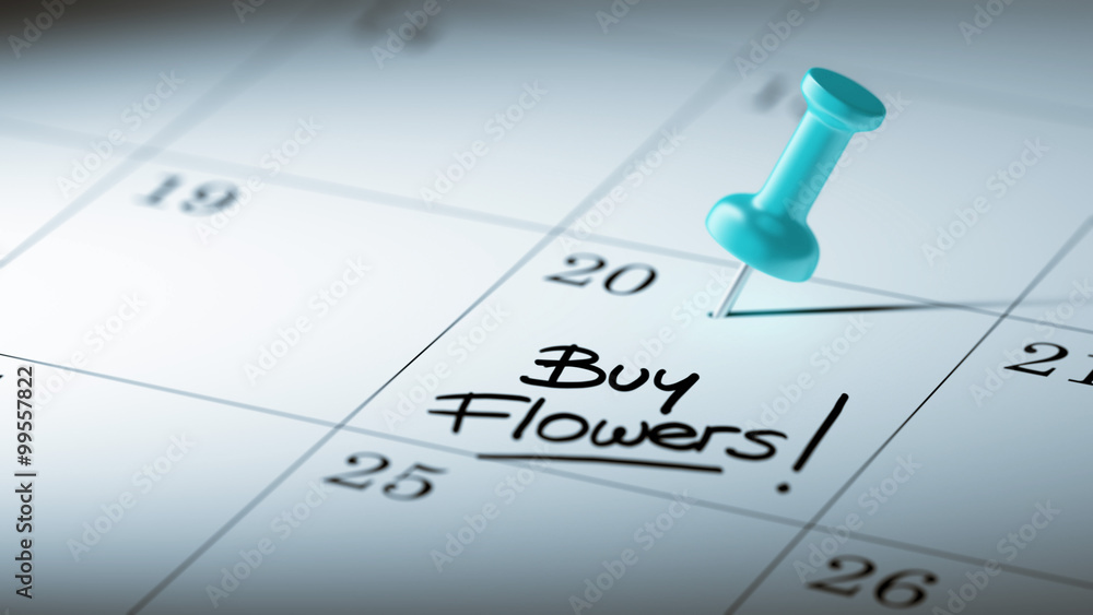 Concept image of a Calendar with a blue push pin. Closeup shot o Concept image of a Calendar with a blue push pin. Closeup shot o