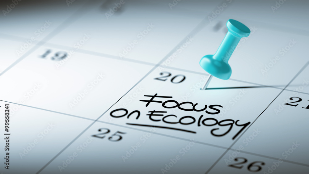 Concept image of a Calendar with a blue push pin. Closeup shot o Concept image of a Calendar with a blue push pin. Closeup shot o