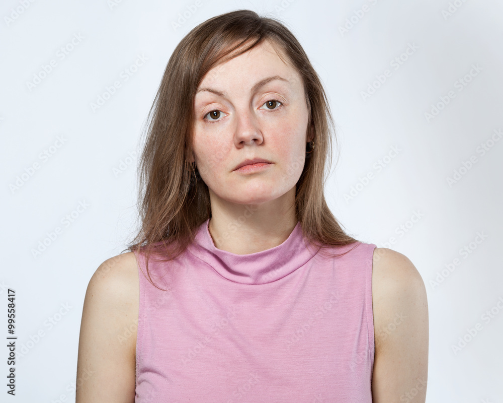 Portrait of a sad woman in a pink shirt Portrait of a sad woman in a pink shirt