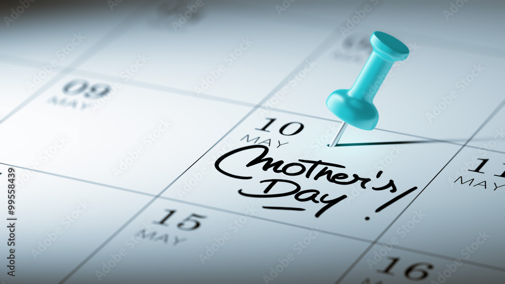 Concept image of a Calendar with a blue push pin. Closeup shot o Concept image of a Calendar with a blue push pin. Closeup shot o