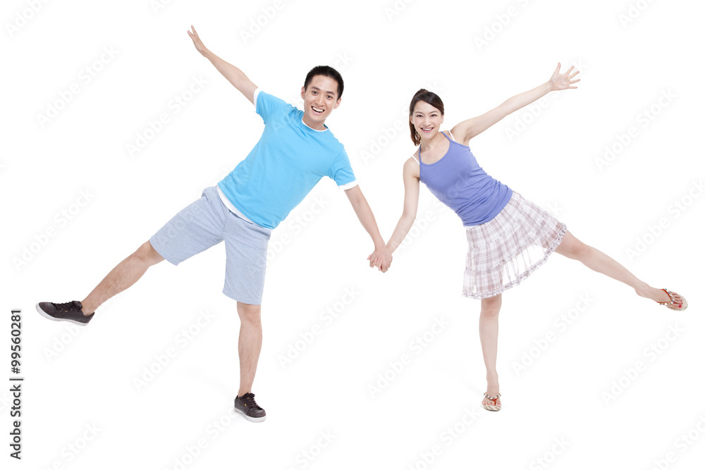 Excited young couple spread-eagled