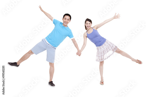 Excited young couple spread-eagled
