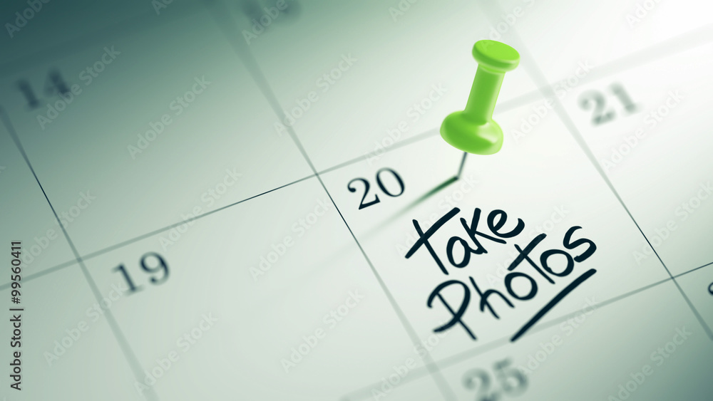 Concept image of a Calendar with a green push pin. Closeup shot Concept image of a Calendar with a green push pin. Closeup shot