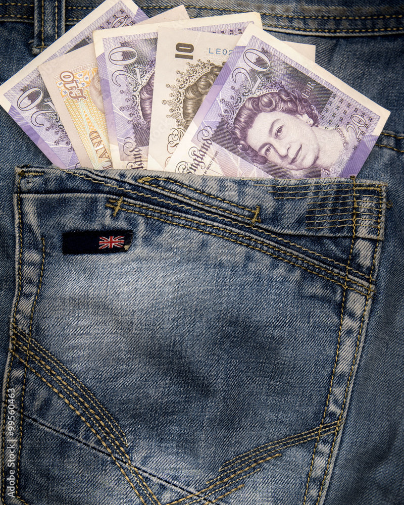 Several british pounds banknotes in english jeans. Several british pounds banknotes in english jeans.