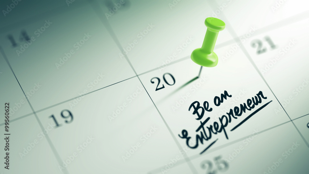 Concept image of a Calendar with a green push pin. Closeup shot