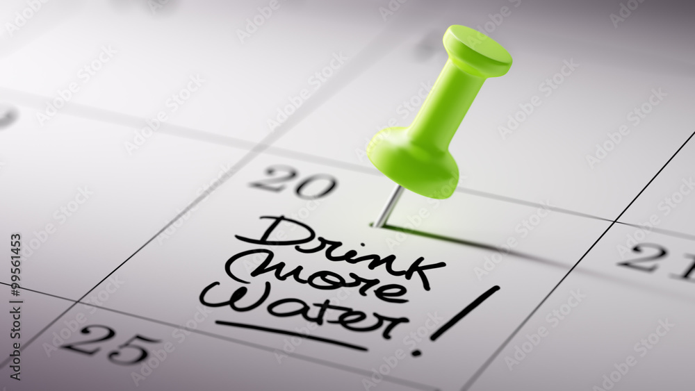 Concept image of a Calendar with a green push pin. Closeup shot Concept image of a Calendar with a green push pin. Closeup shot