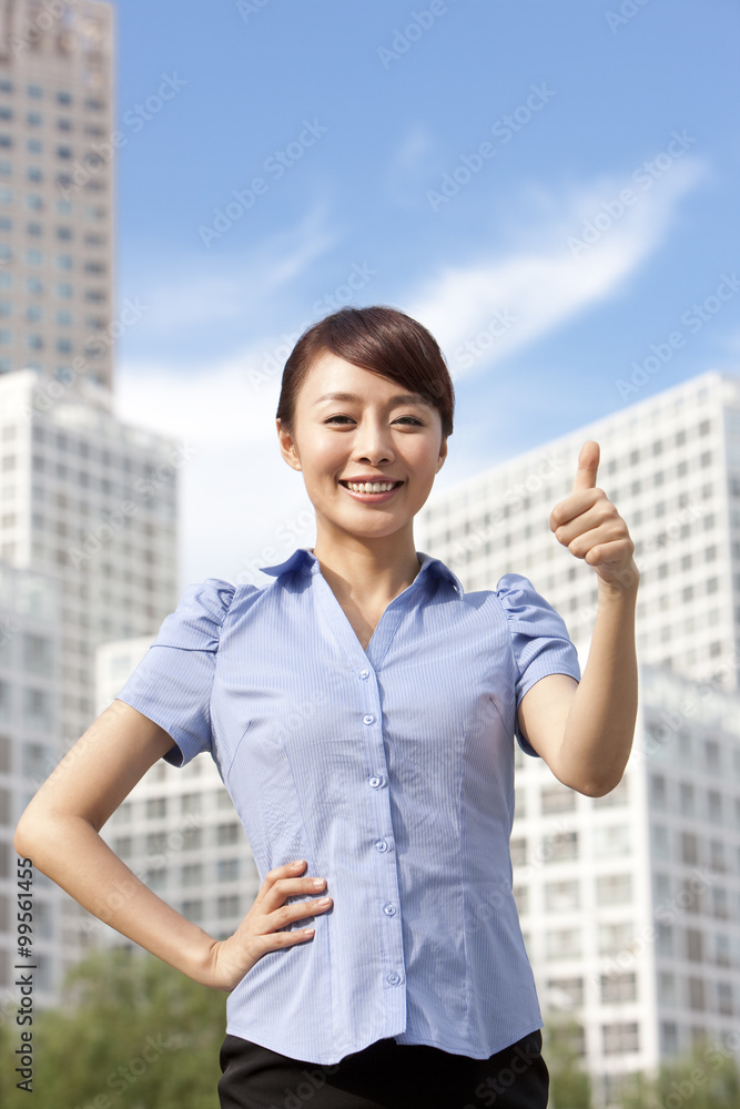 Confident Businesswoman with Thumbs Up