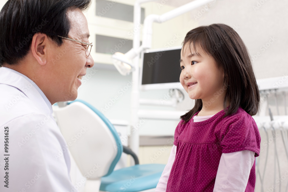 Fototapeta premium Dentist and little patient in dental clinic