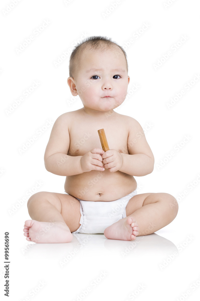 Cute baby boy with biscuit in hand Cute baby boy with biscuit in hand