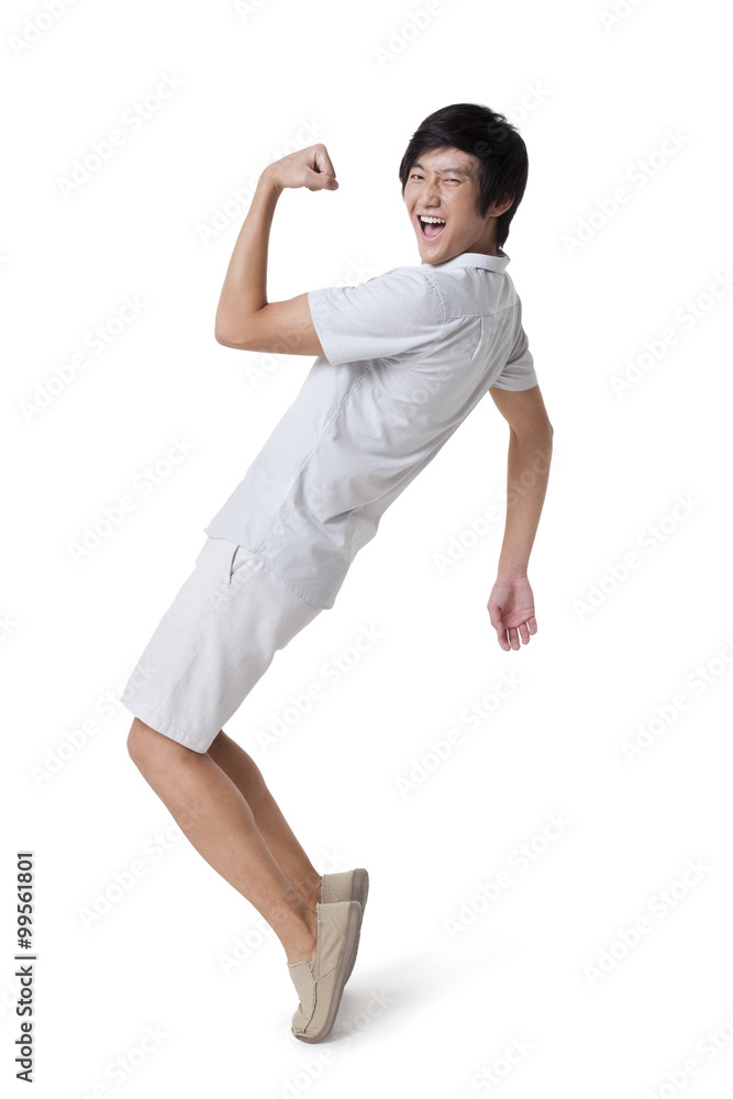 Young Man Standing on Tiptoes