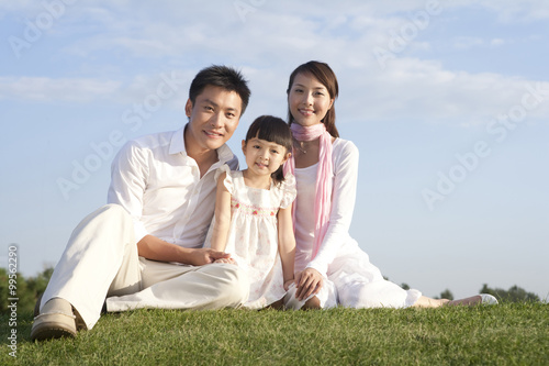 Portrait of a young family outdoors