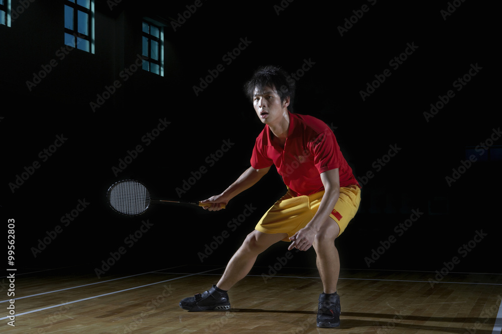 Young Man Playing A Game Of Badminton