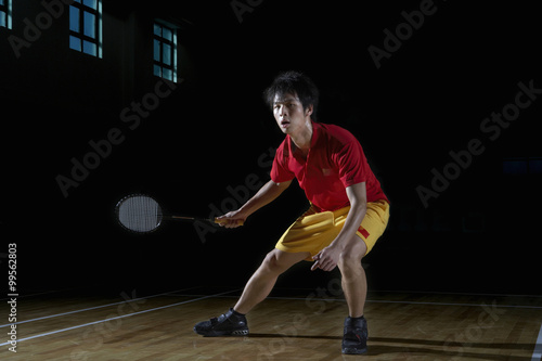 Young Man Playing A Game Of Badminton © Blue Jean Images