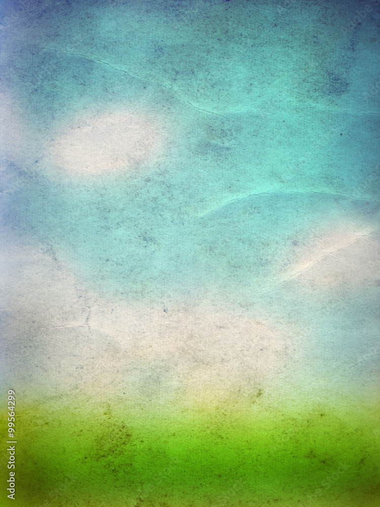 Conceptual green grass and sky old paper