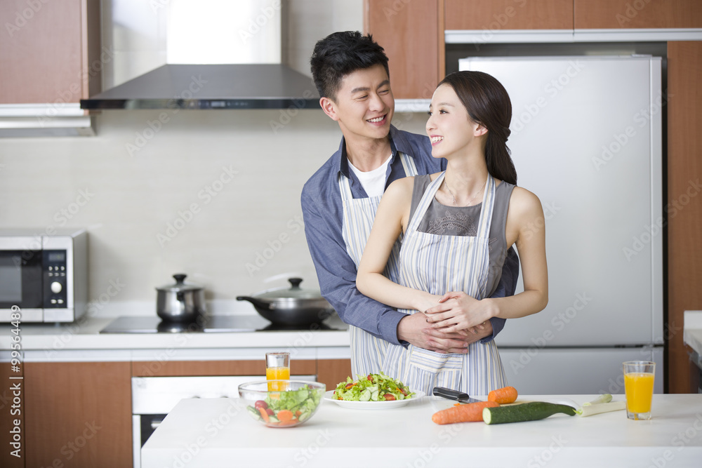 Young couple cooking in the kitchen