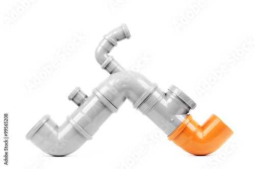 New gray and orange drain pipe isolated on white