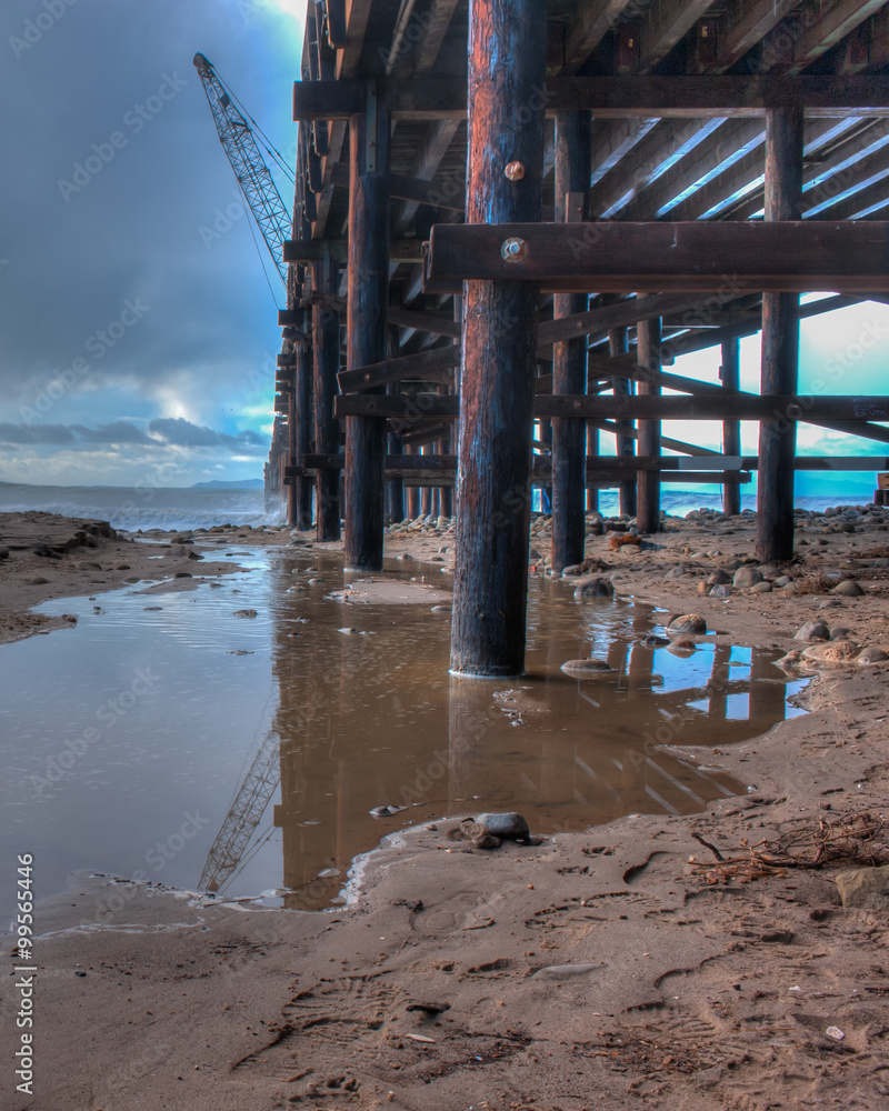 Heavy rains and high tide leave reflection pond under the pier. Heavy rains and high tide leave reflection pond under the pier.