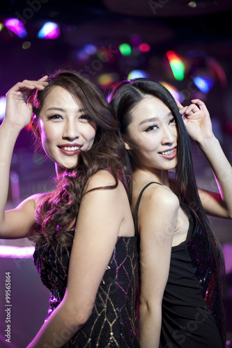 Stylish young women in nightclub