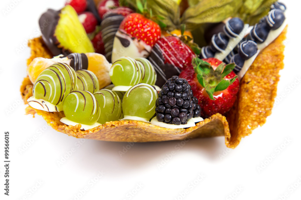 Variety of fresh fruits with decorative chocolate on white background Variety of fresh fruits with decorative chocolate on white background