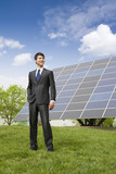 Portrait of a businessman in front of solar panels