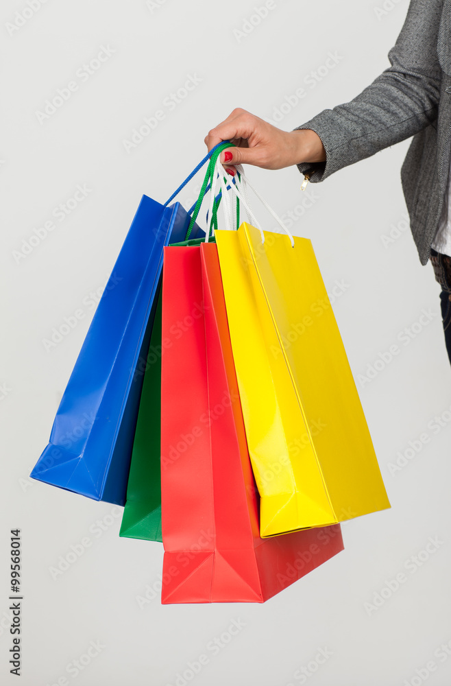 girl with purchases in paper bags color