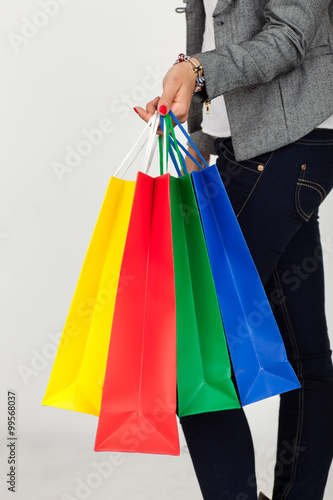 girl with purchases in paper bags color