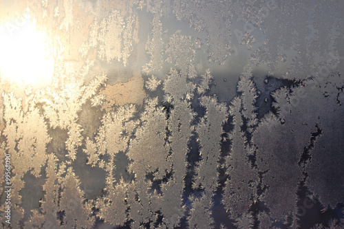 Frozen window covered with frost in winter patterned. © wolfness72