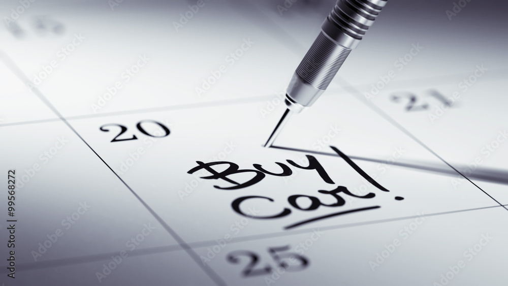 Concept image of a Calendar with a golden dart stick.. The words Concept image of a Calendar with a golden dart stick.. The words