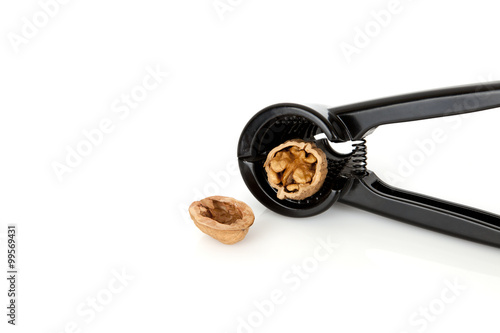 nuts and nutcracker on a white background