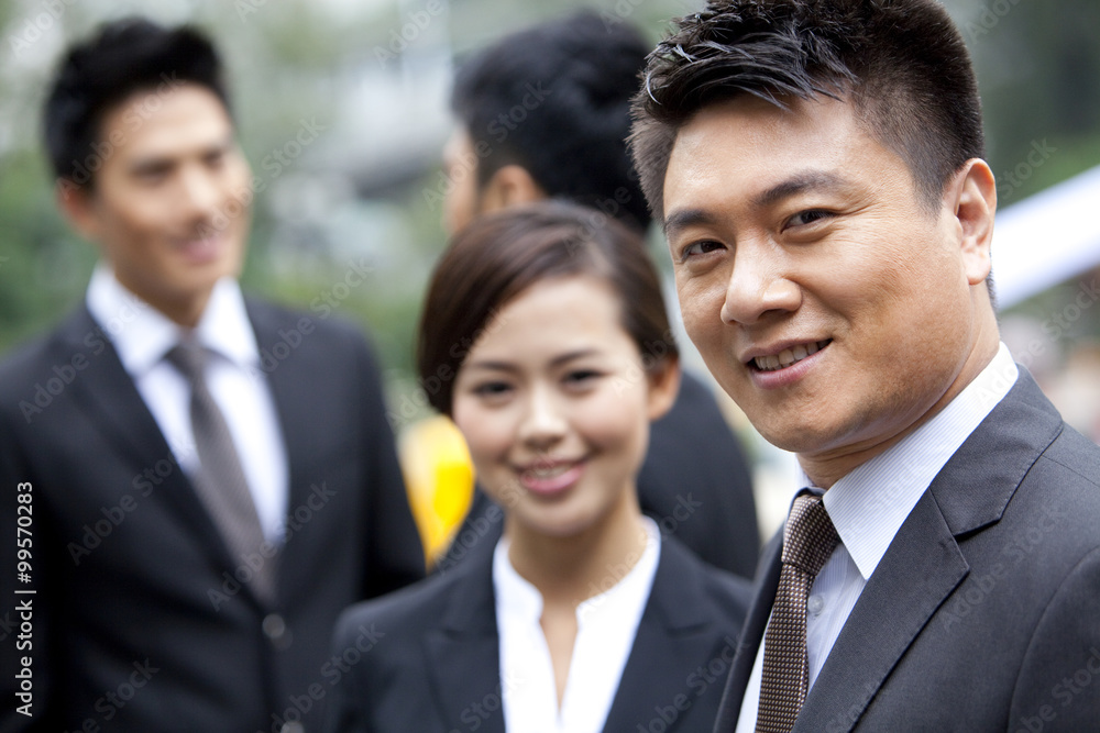 Adroit businessman with his team in Hong Kong Adroit businessman with his team in Hong Kong