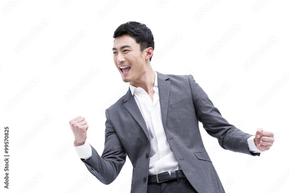 Fashionable businessman punching the air Fashionable businessman punching the air