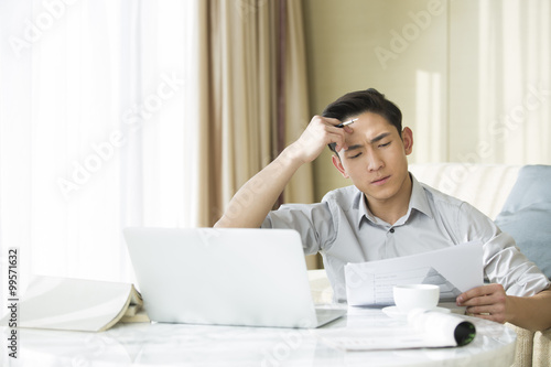 Fotografia Young man working at home