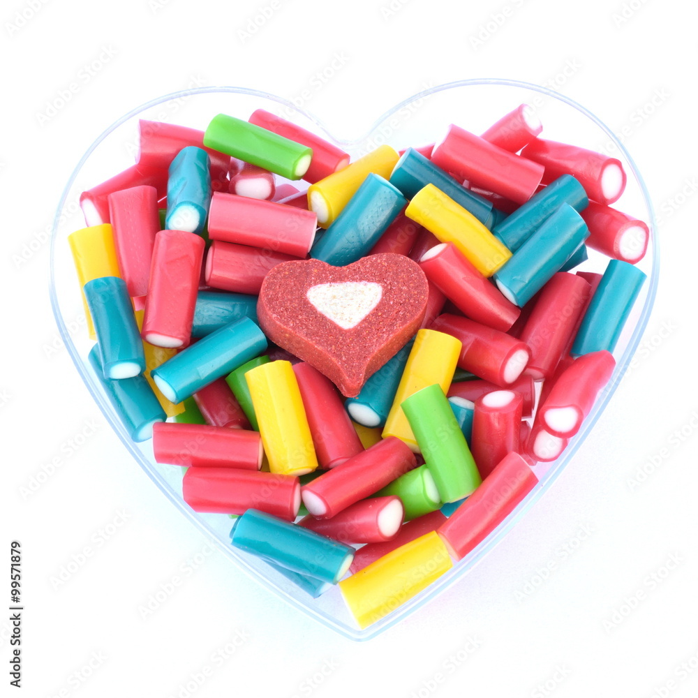 Bowl in shape of hearts filled with colourful sweets Bowl in shape of hearts filled with colourful sweets