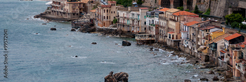 Row of old italian houses fronting the ocean in town Scilla