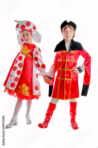 young boy and girl in medieval carnival costume, red caftan, cocked hat, tricorn.red and white fluffy skirt