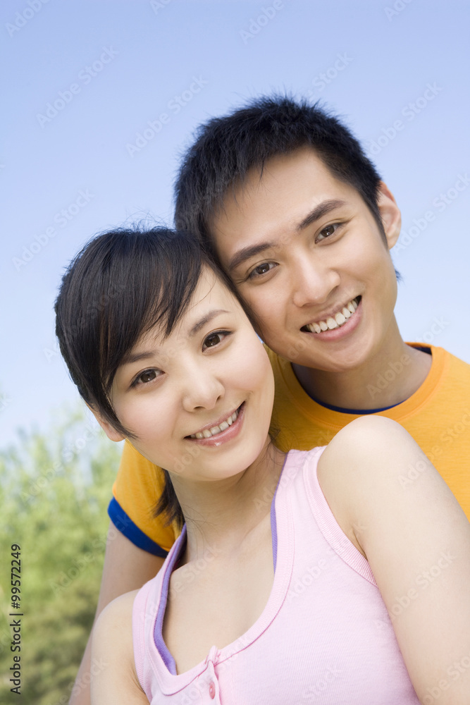 Portrait of a young couple at the park