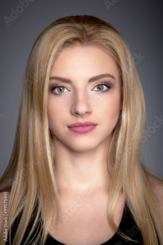 Portrait of a Beautiful Blonde Woman Model black background studio - Stock Image
