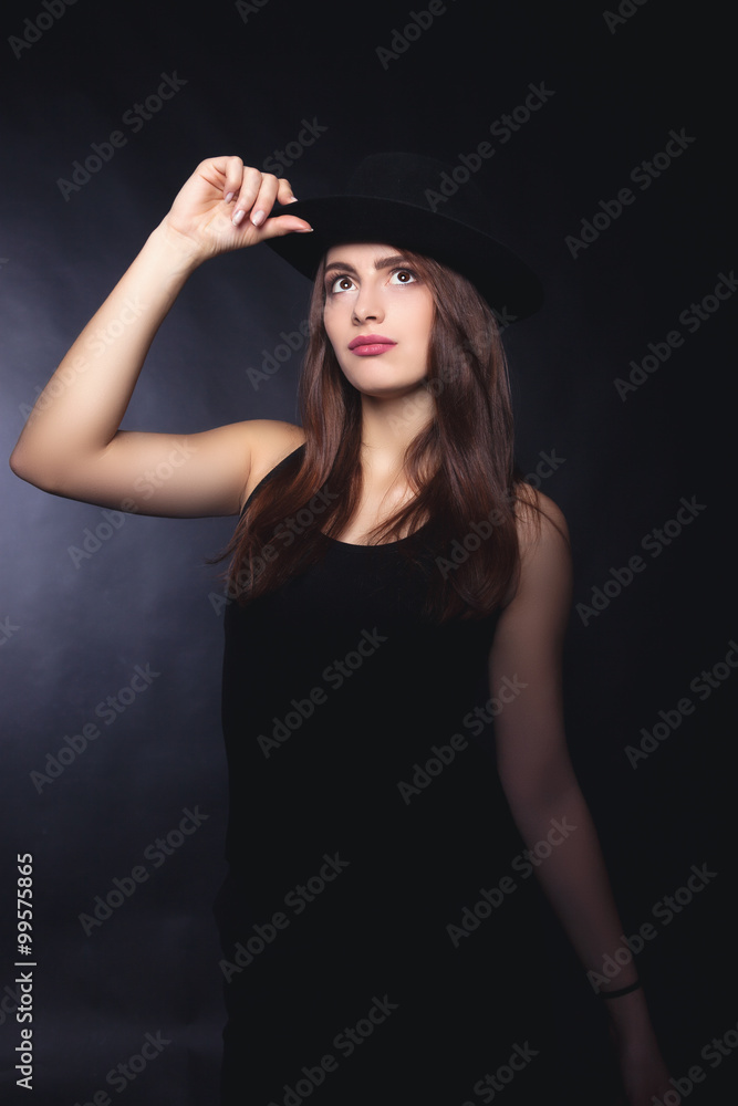 Beautiful woman in retro style with black mafia hat - Stock Image