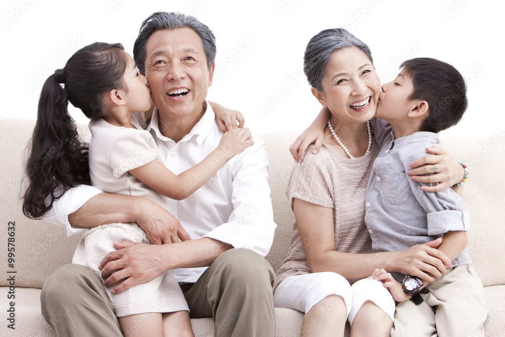 Grandson and granddaughter kissing grandparents Grandson and granddaughter kissing grandparents