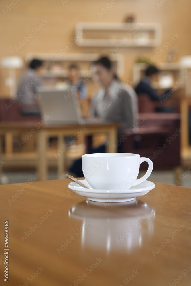 A coffee cup on a table 