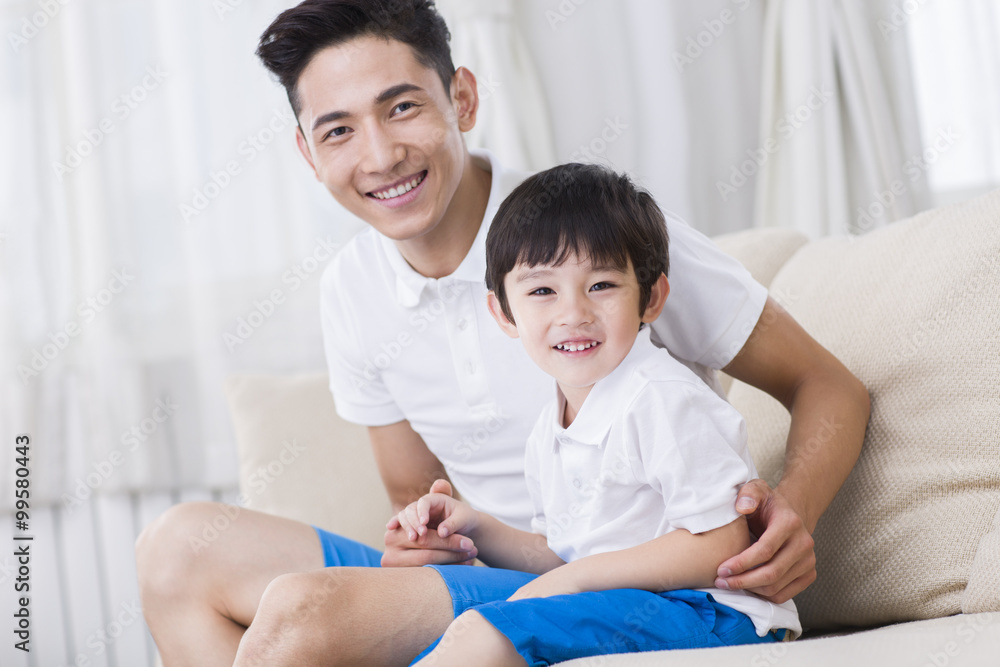 Father and son in family matching clothing Father and son in family matching clothing
