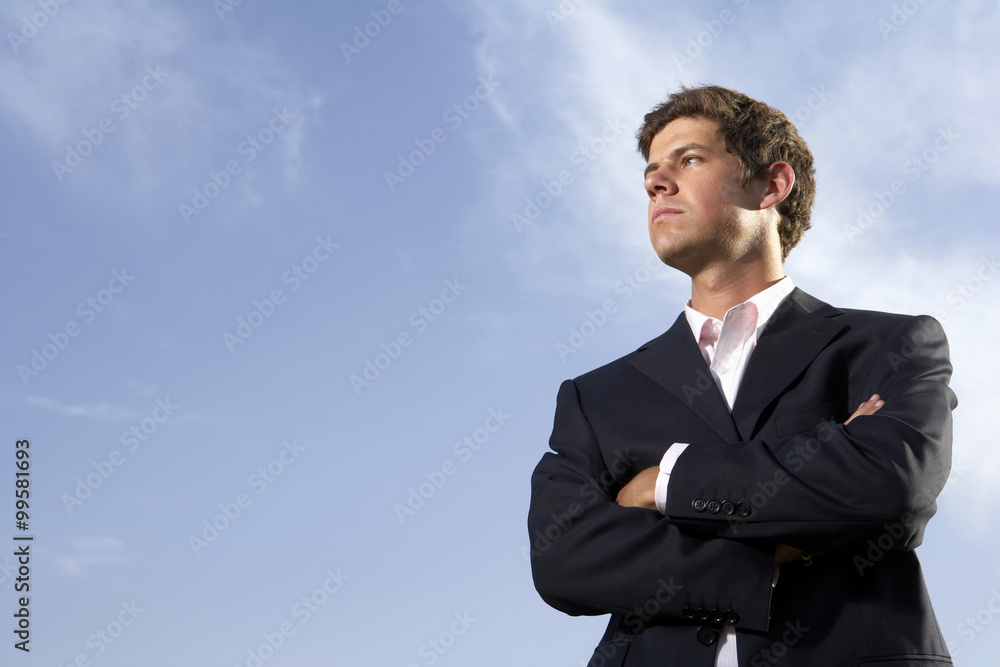 Man Standing In Field, Looking Into The Distance Man Standing In Field, Looking Into The Distance