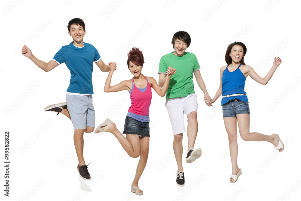 Fototapeta premium Stylish young people jumping in mid-air