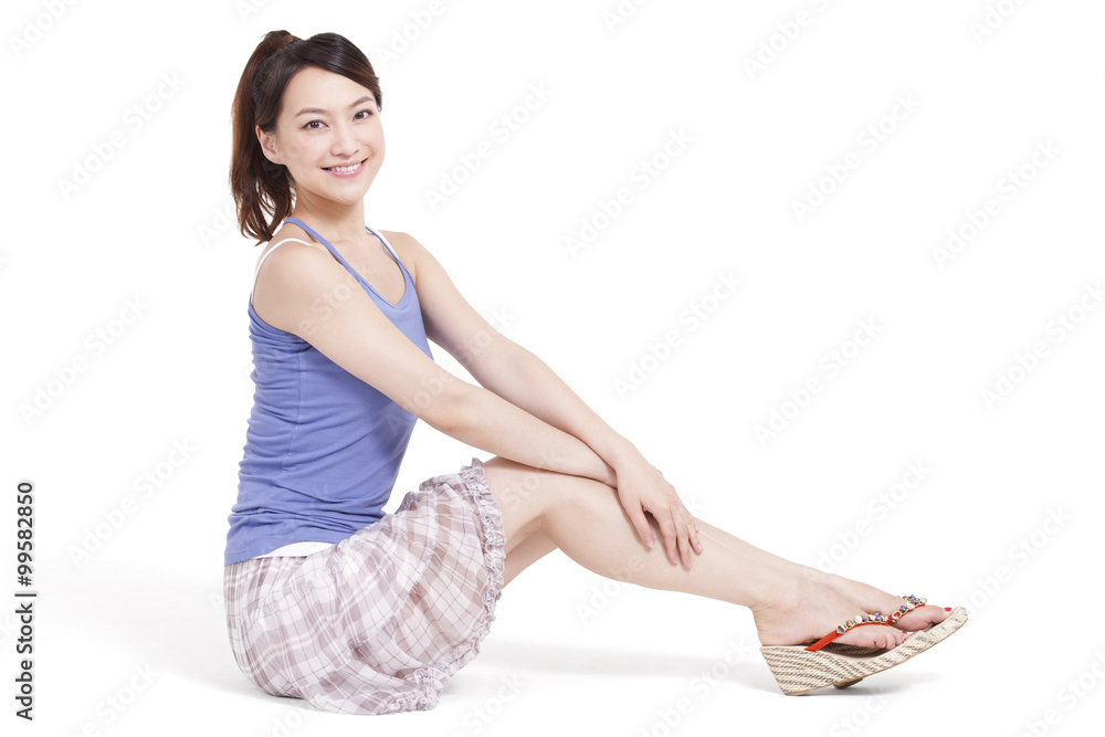 Cheerful young woman sitting on floor Cheerful young woman sitting on floor
