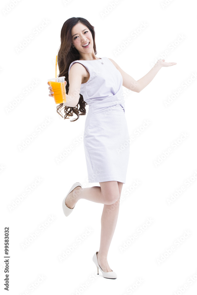 Portrait of beautiful young woman holding a cup of juice Portrait of beautiful young woman holding a cup of juice